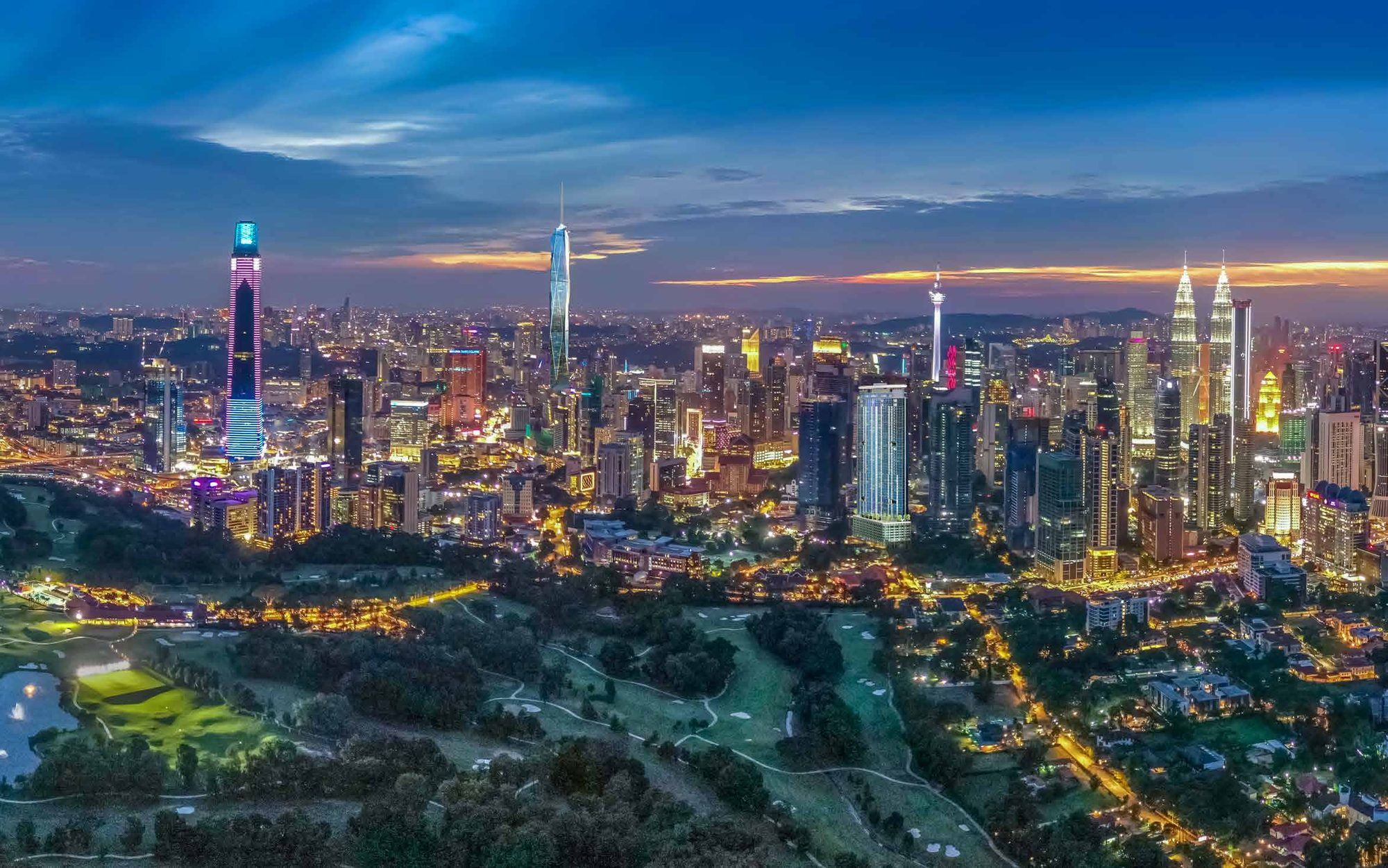 Kuala Lumpur at dusk, looking across the Royal Selangor Golf Club